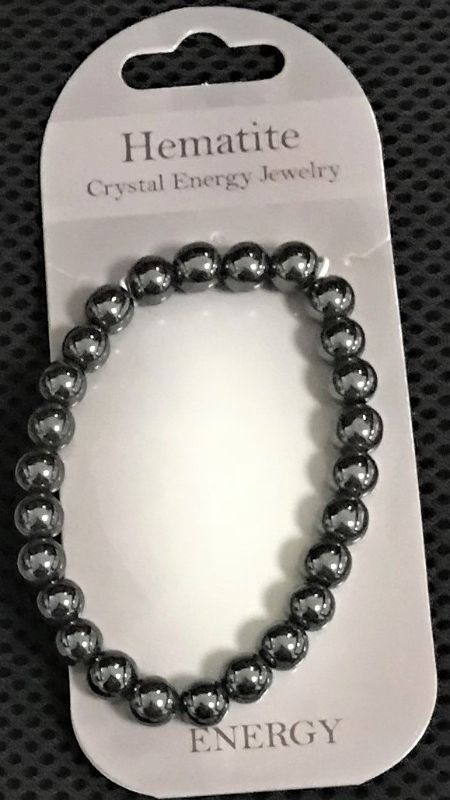 Set of 3 polished hematite bracelets with 8mm beads, offering stylish versatility and grounding properties.