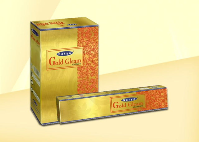 Sathya Nag Gold Gleam incense sticks in a 12-pack, offering soothing fragrance for meditation and relaxation.