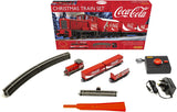 Hornby Coca Cola Xmas Train Set featuring a festive locomotive, wagons with Coca-Cola branding, and Santa Claus for holiday cheer.