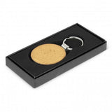 Set of 12 round natural beech wood key rings with metal trim, elegantly packaged in a black gift box.