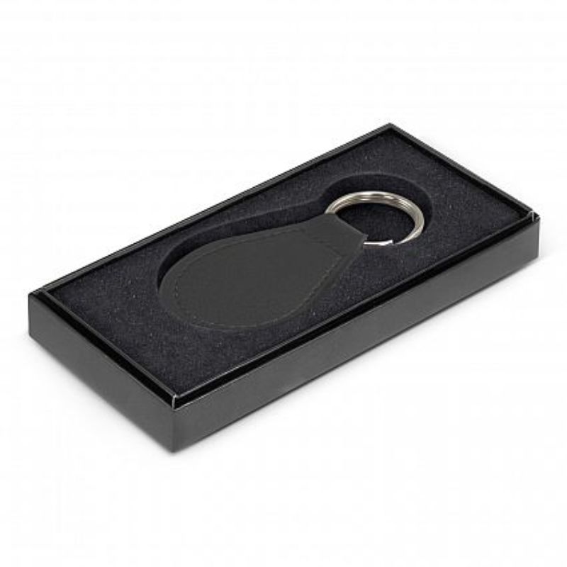 Round black leather key ring with matching stitching, elegantly presented in a black gift box for stylish organization.