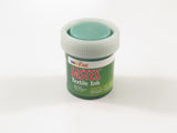 Vibrant green 60ml heat set textile ink for fabric artists, offering color fastness for lasting DIY projects.