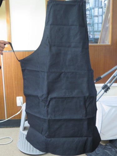 Large charcoal artist apron with spacious pocket, protecting clothing and enhancing creativity for artists.