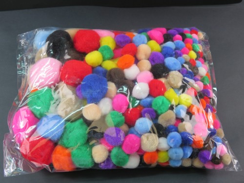 Assorted pom poms in vibrant colors and sizes, perfect for crafts, decorations, and DIY projects. 150 pieces included.