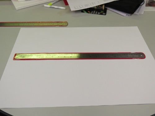 Durable 20-inch stainless steel ruler with clear markings for precise measuring in various projects.