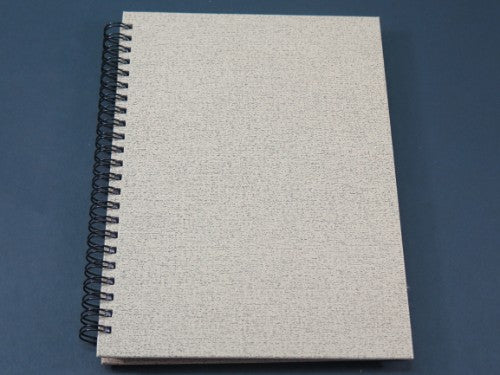 Premium A5 hardcover double spiral notebook made with 70gsm paper, perfect for notes, sketches, and journaling on the go.