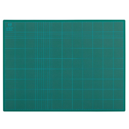 Vibrant green 600x450mm cutting mat made of 3mm PVC, featuring a gridded self-healing surface for precise crafting.