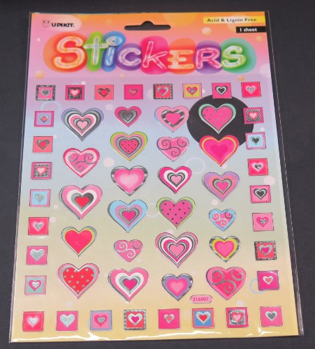 Vibrant pink heart sticker made of durable vinyl, perfect for personalizing laptops, notebooks, and more.