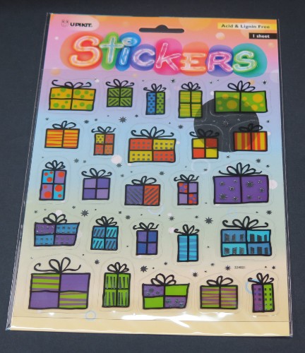 Vibrant present-themed sticker for personalizing gifts, crafts, and decorations, made from durable weather-resistant vinyl.