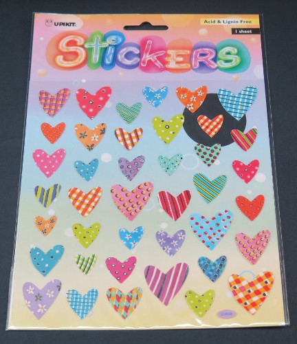 Vibrant heart sticker made from durable vinyl, perfect for personalizing belongings and adding a creative touch.