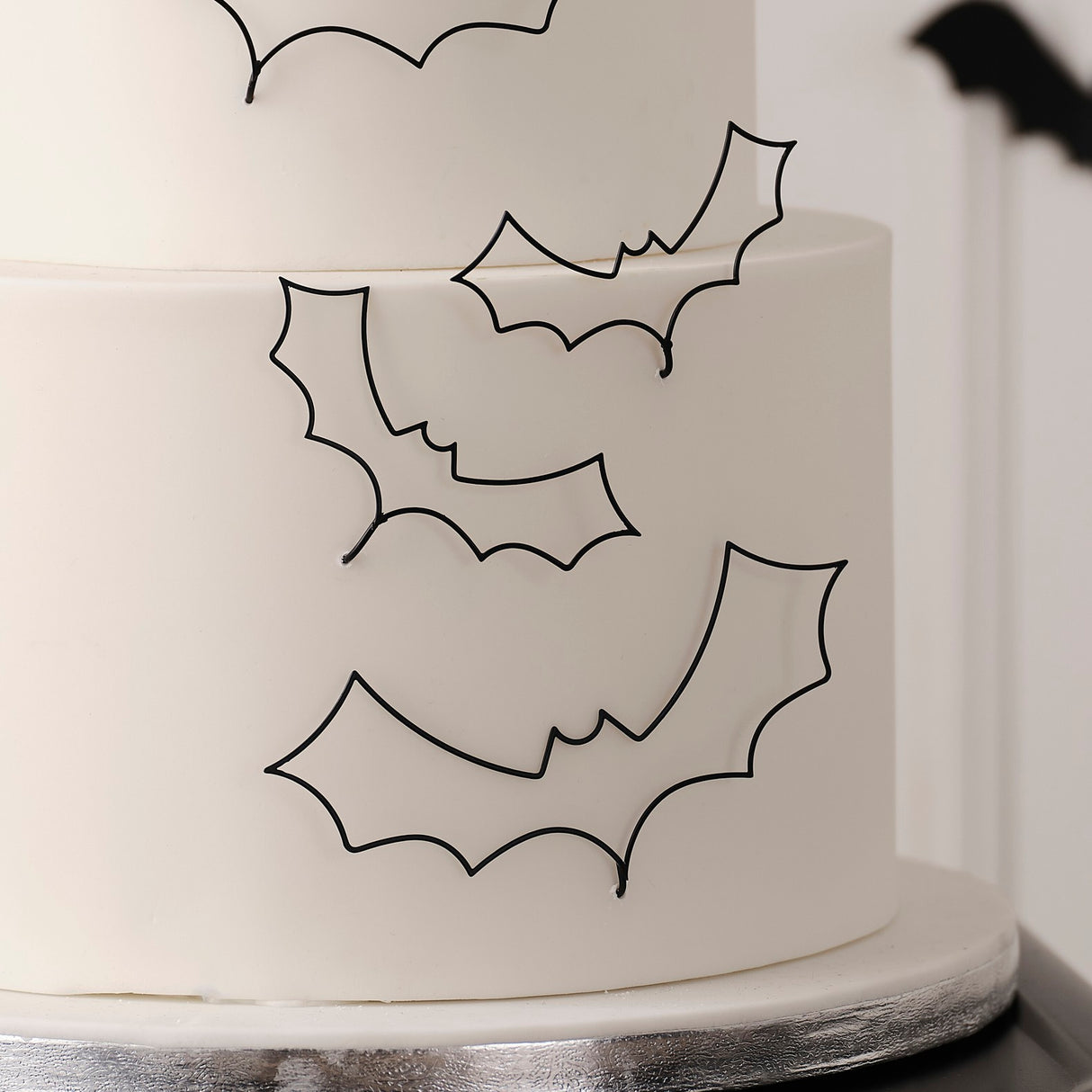 Black wire bat cake decorations for Halloween, featuring two large and three medium bats for a spooky, elegant touch.