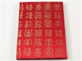 Elegant red silk A5 notebook with gold embroidery, featuring 70gsm premium paper for a luxurious writing experience.