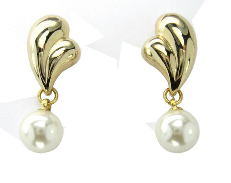 Gold Pearl Earrings with gleaming settings and lustrous pearls, ideal for elevating elegance on any occasion.