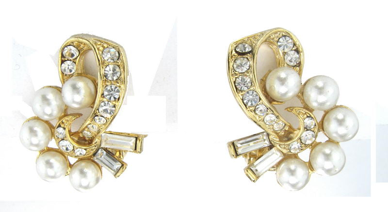 Elegant pearl earrings with rhodium plating and gold accents, perfect for adding luxury to any outfit or occasion.