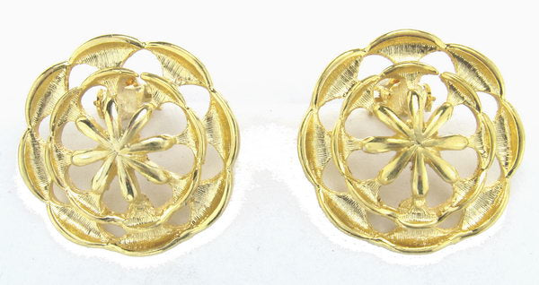 Elegant gold earrings, perfect for any occasion, enhancing both casual and formal outfits with luxurious style.