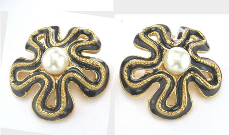 Elegant pearl earrings with gold accents and black enamel, perfect for elevating any outfit.