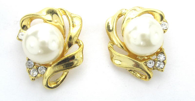 Elegant gold and rhodium earrings featuring lustrous pearls, perfect for any occasion and a beautiful gift option.