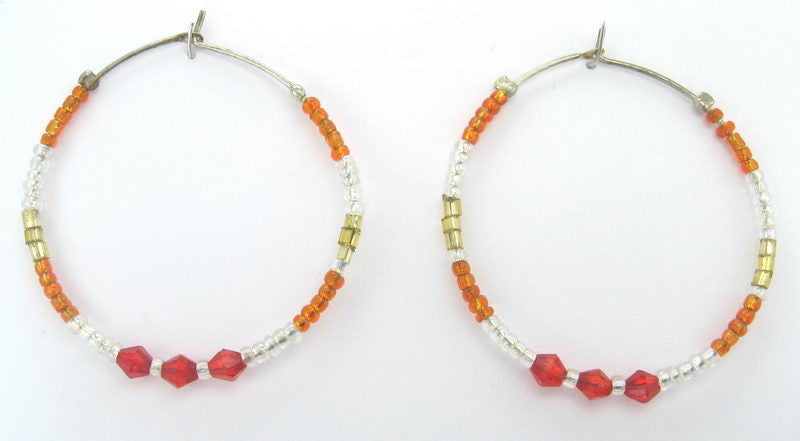 Large green beaded hoop earrings, vibrant design, perfect for casual or special occasions, lightweight and comfortable.