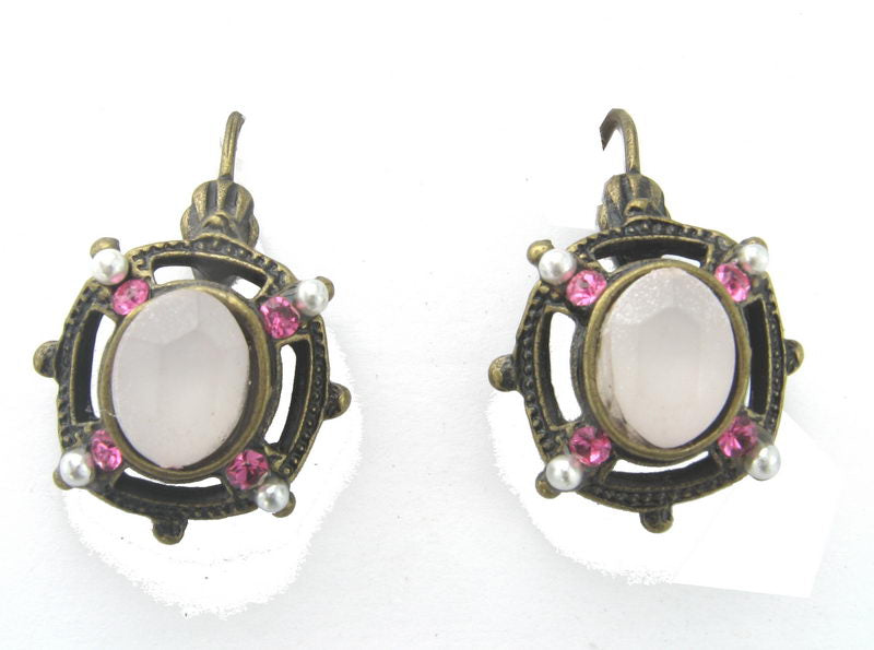 Elegant pink cabochon earrings, perfect for enhancing both casual and formal outfits. Lightweight and stylish accessory.