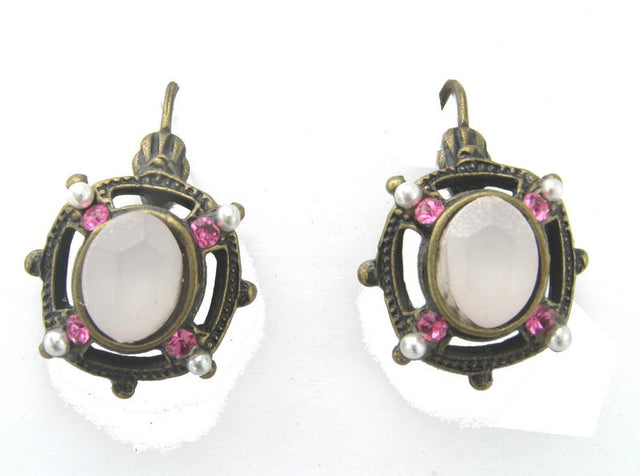 Elegant pink cabochon earrings, perfect for enhancing both casual and formal outfits. Lightweight and stylish accessory.