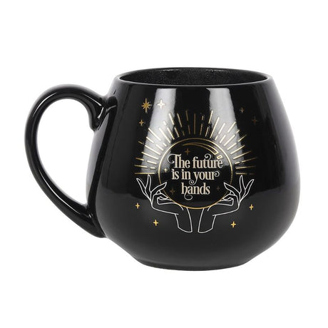 Black mug with a crystal ball design that reveals a hidden fortune when filled with hot liquid, holds 500ml.