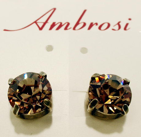 Large Topaz crystal stud earrings in palladium and oxidized bronze, perfect for elegant day or evening wear.