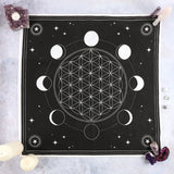 Moon Phase Crystal Grid Altar Cloth featuring an intricate moon phase design and Flower of Life grid for crystal healing.