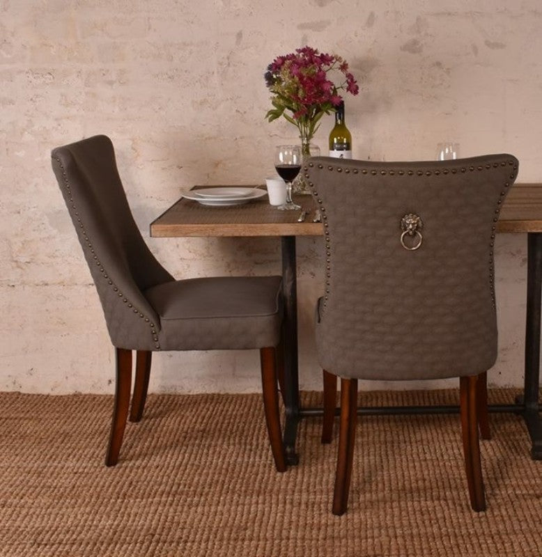 Savoy Dining Chair in Grey, featuring a solid timber frame and luxurious upholstery for elegance and comfort in dining spaces.