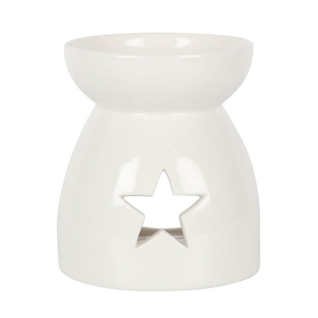 Elegant white ceramic oil burner with star cut-outs, perfect for creating a cozy ambiance while diffusing delightful scents.