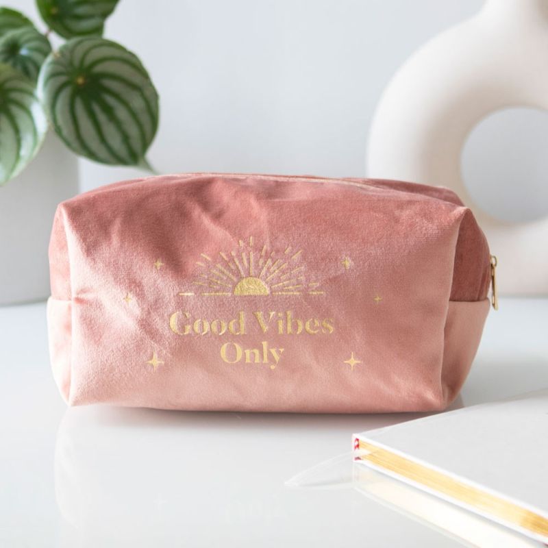 Stylish Good Vibes Only Toiletry Bag with gold text and sun motif, perfect for travel and home organization.