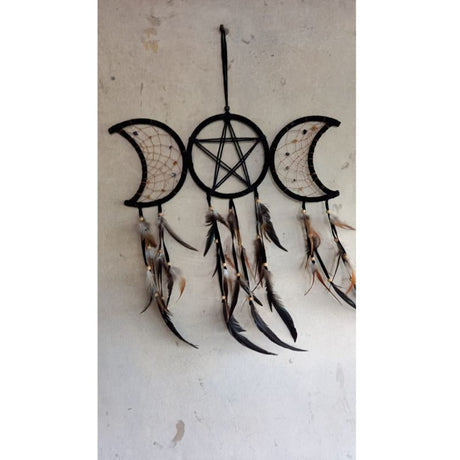 Triple Moon Black Dreamcatcher featuring intricate black netting, beads, and feathers, symbolizing dreams and feminine spirit.