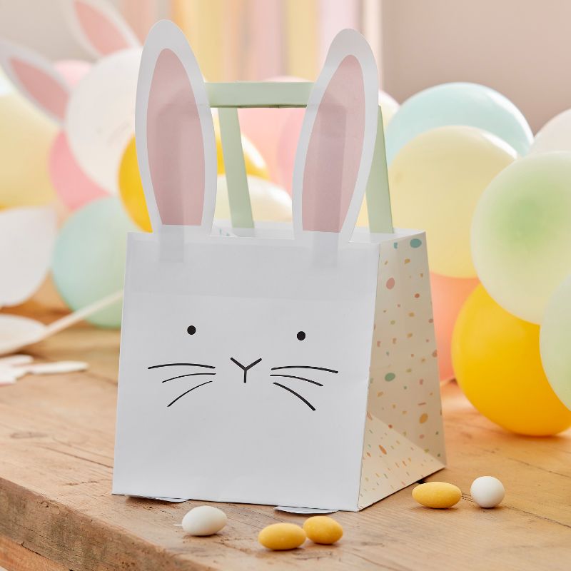 Ginger Ray Easter treat bags with bunny design and pastel handles, perfect for filling with sweets and gifts.