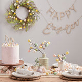 Pastel speckled egg stems for Easter, featuring 5 artificial twigs with plastic eggs, perfect for festive centerpieces.