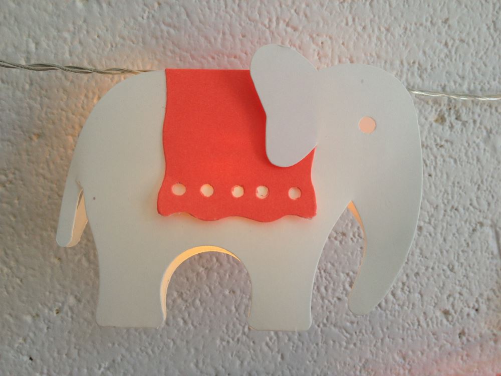 String of 10 whimsical elephant fairy lights with red blankets, 2.3 meters long, perfect for festive decor and kids' rooms.