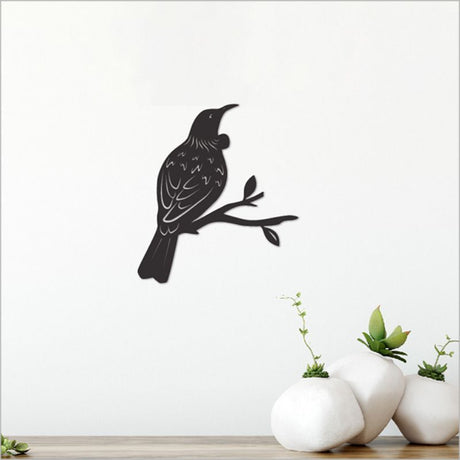 Black acrylic tui wall art measuring 11.6cm, showcasing a stylish silhouette to enhance any modern decor.