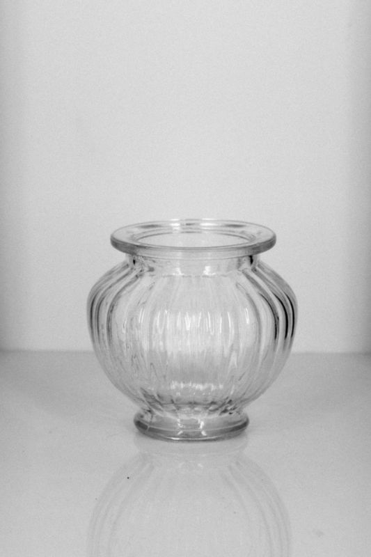 Set of 48 clear ribbed mini belly vases, perfect for showcasing floral arrangements and adding elegance to any decor.