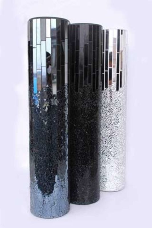 Sleek charcoal glass vase with a mirror finish, perfect for flowers or as a stylish decor piece in any room.