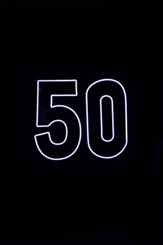 White Neon LED '50' sign, wall-mounted, perfect for 50th birthday celebrations and home decor, measuring 650 x 570mm.