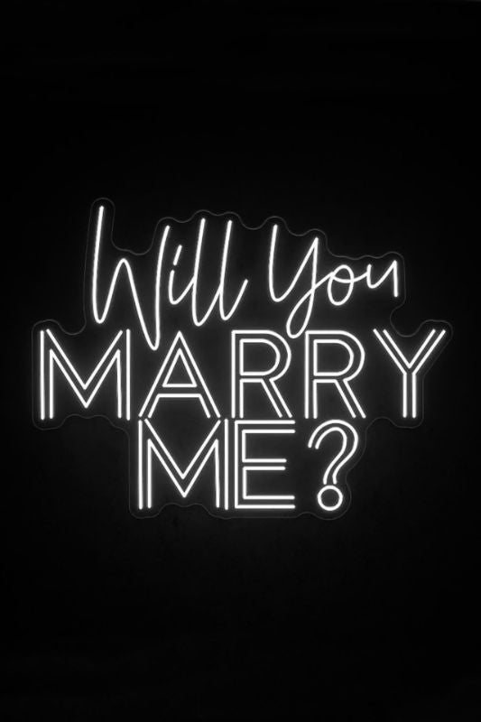Neon LED sign in bright white reading 'Will You Marry Me?' ideal for romantic proposals, includes transformer and extension cord.