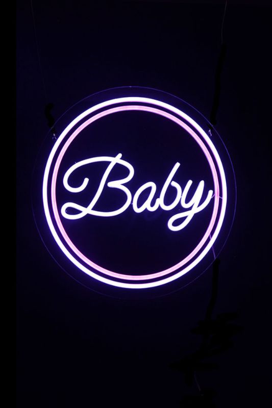 Vibrant pink Neon LED 'Baby' sign, 500mm diameter, perfect for nurseries and events, includes transformer and extension cord.