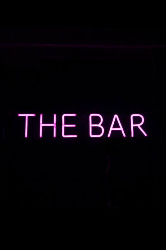 Vibrant cerise Neon LED sign reading 'THE BAR', perfect for adding ambiance to bars and home entertainment areas.