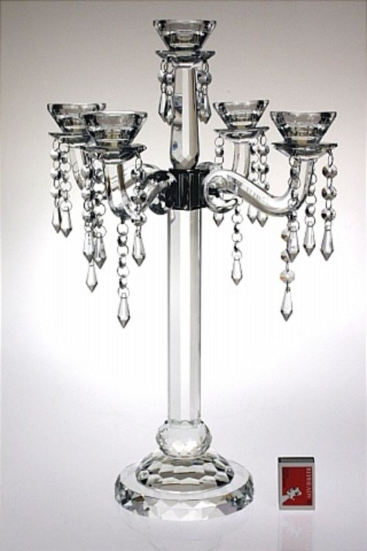 Elegant K9 Crystal Candelabra with 4 arms, 5 holders, and crystal drops, perfect for sophisticated home décor and events.