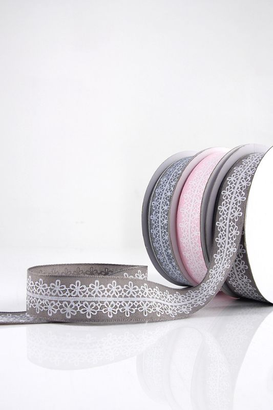 Woven edge pink floral ribbon set of 4, perfect for gift wrapping and crafting, featuring a charming white floral pattern.