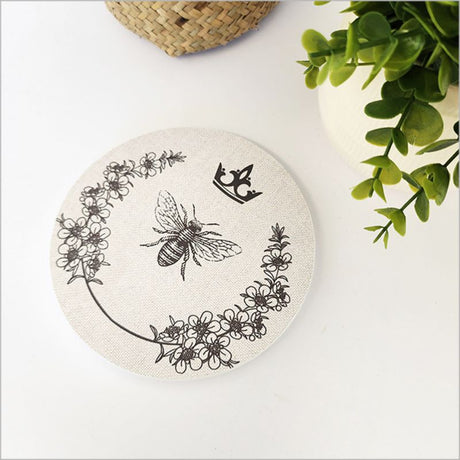 Canvas circle wall art featuring a printed Manuka bee design, 15cm diameter, perfect for nature-inspired home decor.