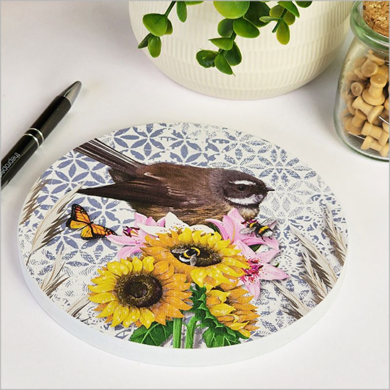 Circular canvas wall art featuring an embossed New Zealand fantail, ideal for adding nature-inspired decor to any space.