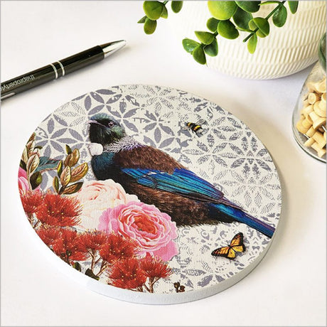 Canvas circle wall art featuring a Tui bird surrounded by floral designs, perfect for home decor and gifts.