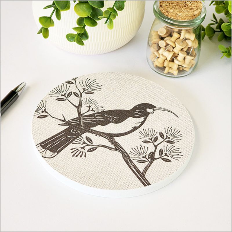 Canvas wall art featuring a Huia bird on a Pohutukawa backdrop, 15cm in diameter, perfect for nature-inspired decor.