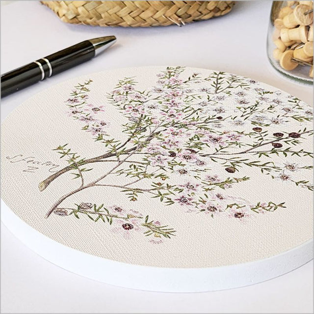 Canvas circle wall art featuring a vibrant Manuka flower design, 15cm diameter, perfect for enhancing any space.