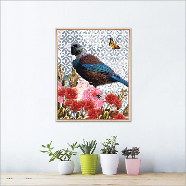 Framed canvas art featuring a vibrant floral design and a tui bird, perfect for enhancing any living space.