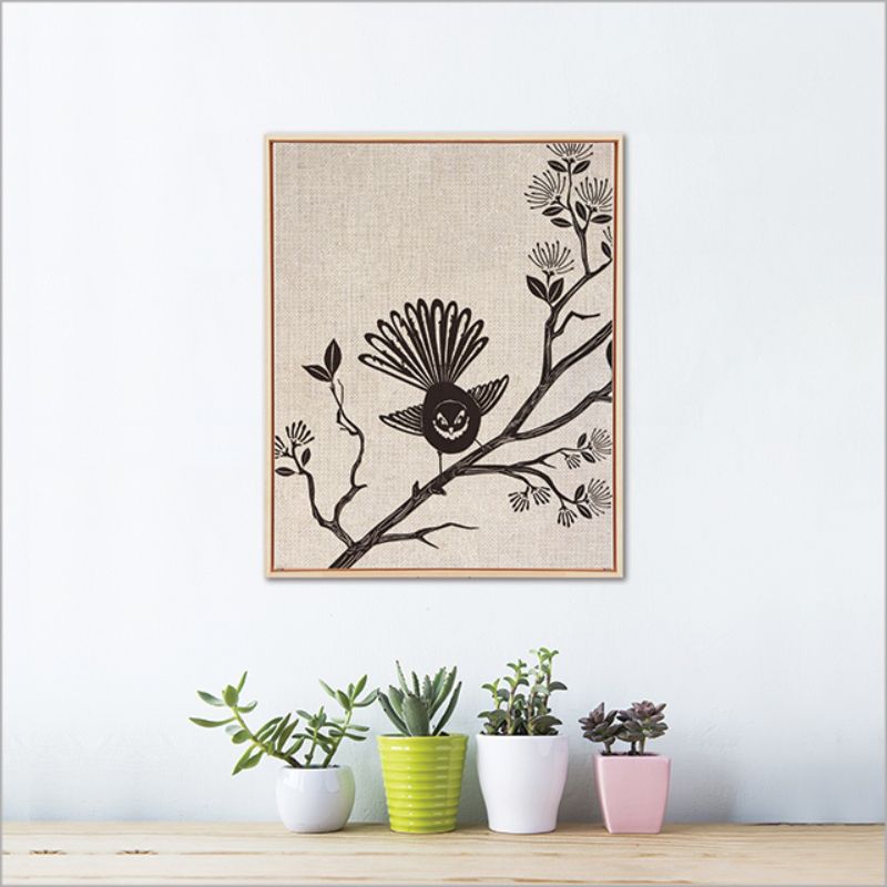 Framed canvas wall art featuring a vibrant fantail bird, eco-friendly ink, measuring 52.5 cm, ready to hang.